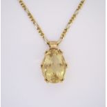 A CITRINE PENDANT claw set with an oval-shaped mixed-cut citrine weighing approximately 14.81cts, in