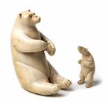 TWO CARVED IVORY FIGURES OF BEARS NOT SUITABLE FOR EXPORT in sizes, one seated on its hind legs, the