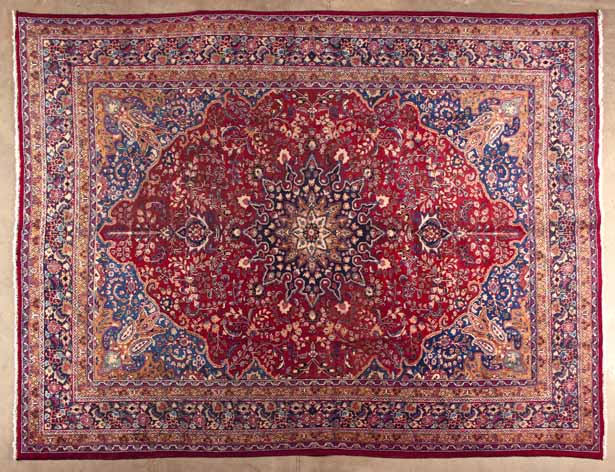 A KESHAN CARPET,PERSIA,MODERN the red field with a slate-blue and ivory floral medallion, similar