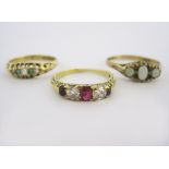 A MISCELLANEOUS GROUP OF THREE EDWARDIAN-STYLE GEM-SET RINGS of various designs, distress,