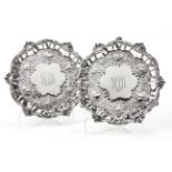 A PAIR OF GEORGE II SILVER SALVERS, WILLIAM PEASTON, LONDON, 1751 each circular body with a C-scroll