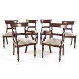 A SET OF SIX REGENCY MAHOGANY AND UPHOLSTERED DINING CHAIRS comprising: a pair of carvers and four