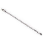 A DIAMOND TENNIS BRACELET claw set with thirty-two brilliant-cut diamond weighing 6.8210cts in