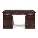 A VICTORIAN MAHOGANY PEDESTAL DESK the moulded rectangular top with a gilt-tooled leather-inset
