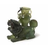 A CHINESE CARVED JADEITE 'KYLIN' VASE the recumbent horned beast with mouth agape and baring