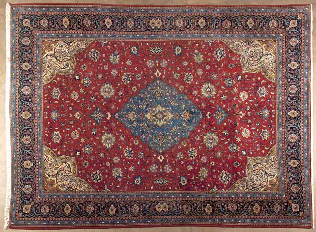 A FINE SAROUK CARPET,PERSIA,MODERN the red field with a sky-blue floral medallion, ivory