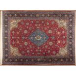 A FINE SAROUK CARPET,PERSIA,MODERN the red field with a sky-blue floral medallion, ivory