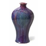 A CHINESE FLAMBE-GLAZED BALUSTER VASE, 19TH CENTURY the slightly lobed body with overall streaked