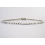 A DIAMOND TENNIS BRACELET claw set with brilliant-cut diamonds weighing approximately 2.6cts in