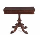 A VICTORIAN MAHOGANY CARD TABLE the hinged rounded rectangular swivel top enclosing a compartment,