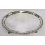 A GEORGE III SILVER SALVER, WILLIAM BATEMAN, LONDON, 1807 the oval body with gadrooned rim centred