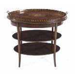 AN EDWARDIAN MAHOGANY AND INLAID TRAY-ON-STAND in two parts, the oval tray with opposing brass