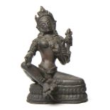 A NEPALESE PATINATED BRONZE FIGURE OF TARA seated in lalitasana on a double-lotus throne with her