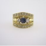 A SAPPHIRE AND DIAMOND RING centred with a claw-set circular-cut sapphire weighing approximately 0.