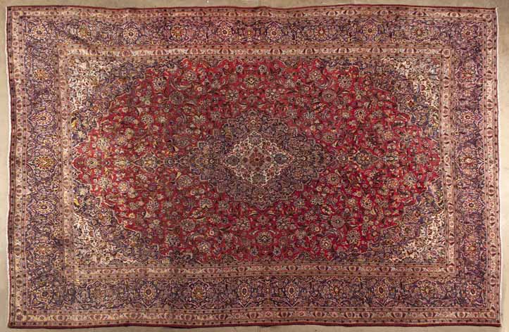 A MESHED CARPET,EAST PERSIA,MODERN the red field with an indigo-blue and ivory star medallion,
