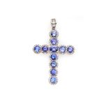 A TANZANITE AND DIAMOND PENDANT in the form of a Latin cross, claw set with circular and oval-shaped