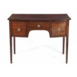 A MAHOGANY BOWFRONTED SIDEBOARD, 19TH CENTURY the rectangular top above a central frieze drawer