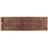 A BIJARI RUNNER,PERSIA,MODERN the red field with a small floral medallion, all with multi-coloured