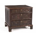 AN OAK CHEST OF DRAWERS, 18TH CENTURY the rectangular moulded top above three graduating drawers,