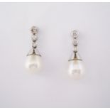 A PAIR OF DIAMOND AND PEARL PENDANT EARRINGS each designed as an articulated line of brilliant-cut