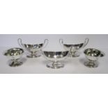 A SET OF THREE GEORGE III SILVER TWO-HANDLED SALT CELLARS, MAKER'S MARK IH, LONDON, 1788 each boat-