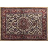 AN ISPAHAN RUG, PERSIA, MODERN the ivory field with a red floral star medallion, all with polychrome