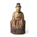 A CHINESE LACQUER AND GILTWOOD TEMPLE FIGURE OF A SEATED OFFICIAL wearing a loose belted robe open