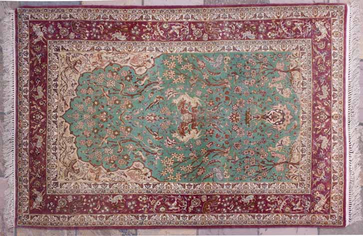 AN ISPAHAN PART-SILK PRAYER RUG,PERSIA,MODERN the turquoise mehrab with an ascending design of