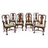 A SET OF EIGHT GEORGE II STYLE WALNUT DINING CHAIRS, 20TH CENTURY each with a vase-shaped splat,
