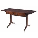 A REGENCY MAHOGANY SOFA TABLE the rectangular top with hinged drop sides above a pair of frieze