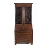 AN EDWARDIAN MAHOGANY AND INLAID DISPLAY CABINET the outswept cornice above an inlaid frieze, a pair