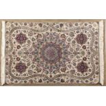 A NAIN RUG,PERSIA,MODERN the ivory field with a round multi-coloured star medallion, red floral