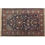 A KESHAN PRAYER RUG, PERSIA,MODERN the deep indigo-blue mehrab with a small floral medallion and