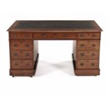 A VICTORIAN MAHOGANY PEDESTAL DESK the rectangular rounded top with a gilt-tooled leather-inset