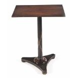 A WILLIAM IV MAHOGANY AND EBONISED SIDE TABLE the rectangular top on a gadrooned and decorated