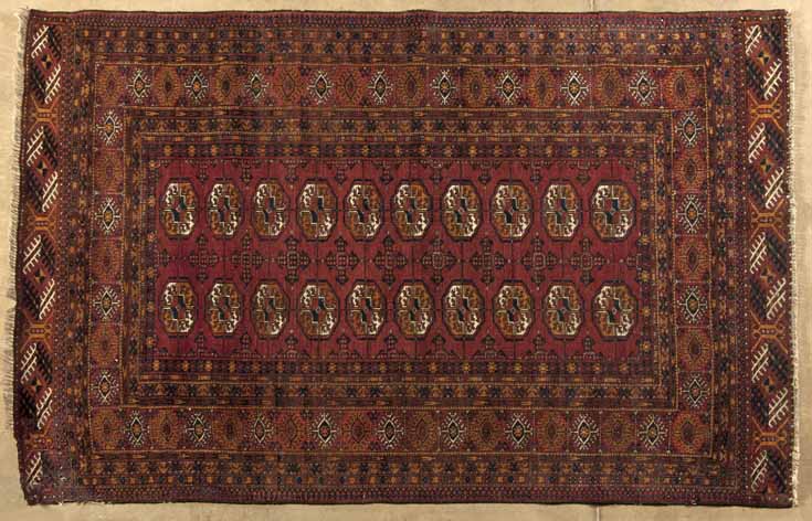 A AFGHAN RUG, MODERN the red field with two rows of ten guls depicted in orange, ivory and red