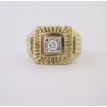 A DIAMOND SIGNET RING centred with a brilliant-cut diamond weighing approximately 0.25cts, the