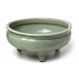 A CHINESE CELADON-GLAZED TRIPOD BULB BOWL, MING DYNASTY, 1368-1644 the exterior carved with  a
