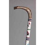 A ZULU BEADED STAFF the handle carved in the form of a snake's head, inscribed Madon 86,5cm long (