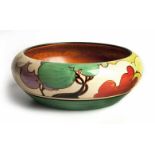 A CLARICE CLIFF 'AUTUMN' PATTERN BOWL, 1931 the exterior painted with cottages amongst bushes and