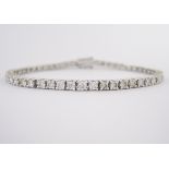 A DIAMOND TENNIS BRACELET claw set with brilliant-cut diamonds weighing approximately 3.5cts in