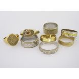 A MISCELLANEOUS GROUP OF EIGHT RINGS of various designs and sizes, comprising: two 18ct gold wedding