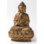 A CHINESE GILT BRONZE FIGURE OF A SEATED BUDDHA seated in dhyanasana and attired in loose robes