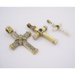 A MISCELLANEOUS GROUP OF THREE CRUCIFORM PENDANTS of various designs and sizes, in 9ct gold (3)