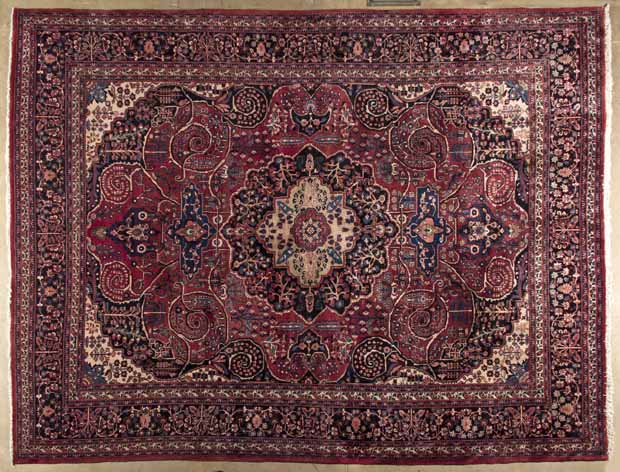 A MESHED CARPET,EAST PERSIA,MODERN the burgundy-red field with indigo-blue and camel floral