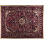 A MESHED CARPET,EAST PERSIA,MODERN the burgundy-red field with indigo-blue and camel floral