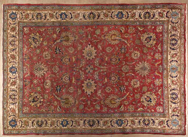 A TABRIZ CARPET,NORTH WEST PERSIA,CIRCA 1960 the terracotta field with an overall design of bold