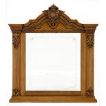 A VICTORIAN STYLE OVERMANTEL GILTWOOD MIRROR the rectangular plate within a carved frame
