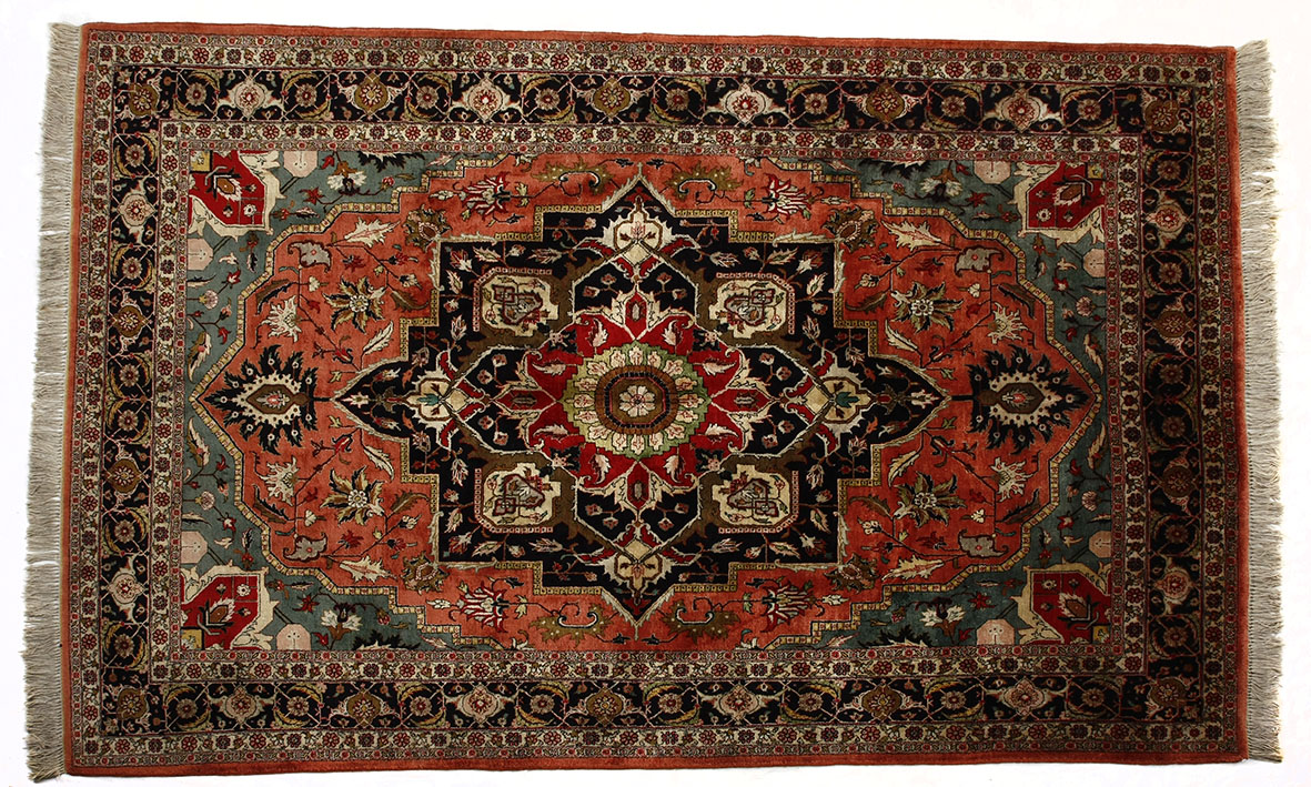 A TABRIZ SILK RUG, NORTH WEST PERSIA MODERN the red field with a stylised dark indigo blue and red