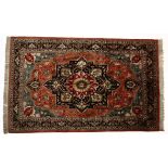 A TABRIZ SILK RUG, NORTH WEST PERSIA MODERN the red field with a stylised dark indigo blue and red